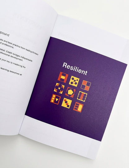 Open book with a purple page featuring the word 'Resilient' and various icons.