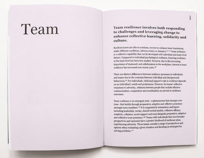Open book with text on team resilience on a white background